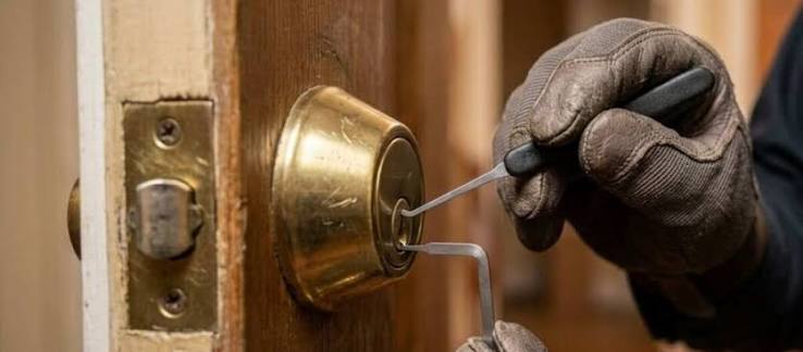 Locksmith tools near a door lock
